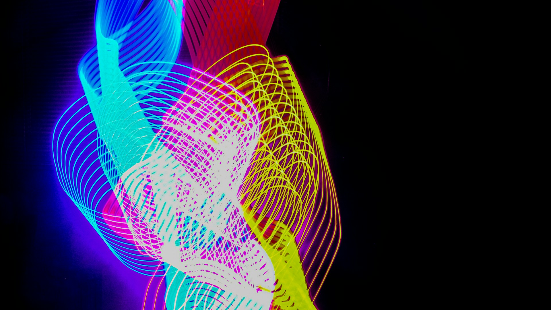 Blue, red and yellow lights intertwined